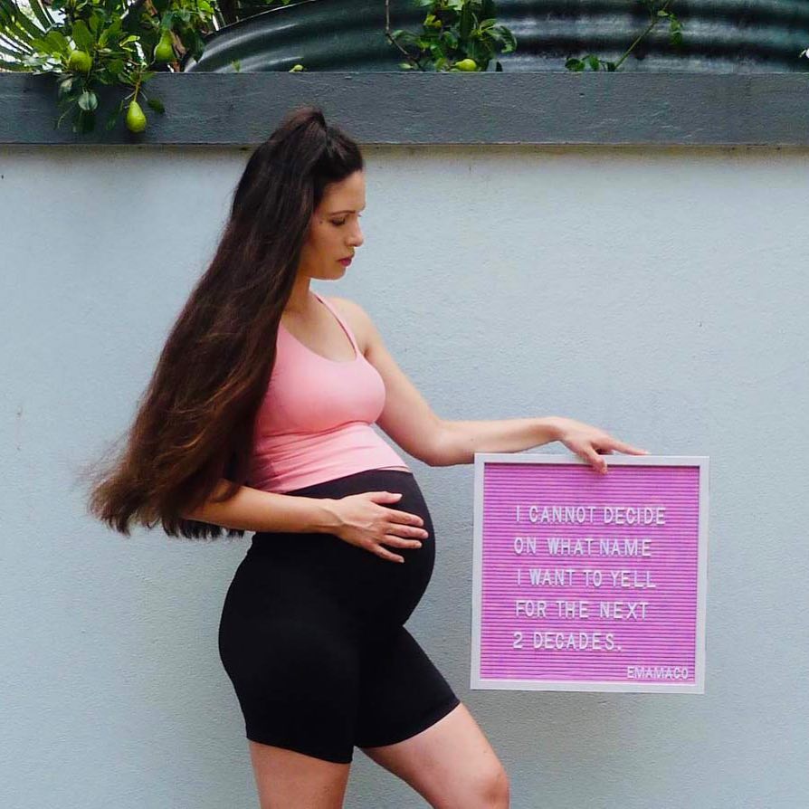 A diverse group of mothers in comfortable activewear, some pregnant and some with babies, looking happy and relaxed in a bright, natural setting.