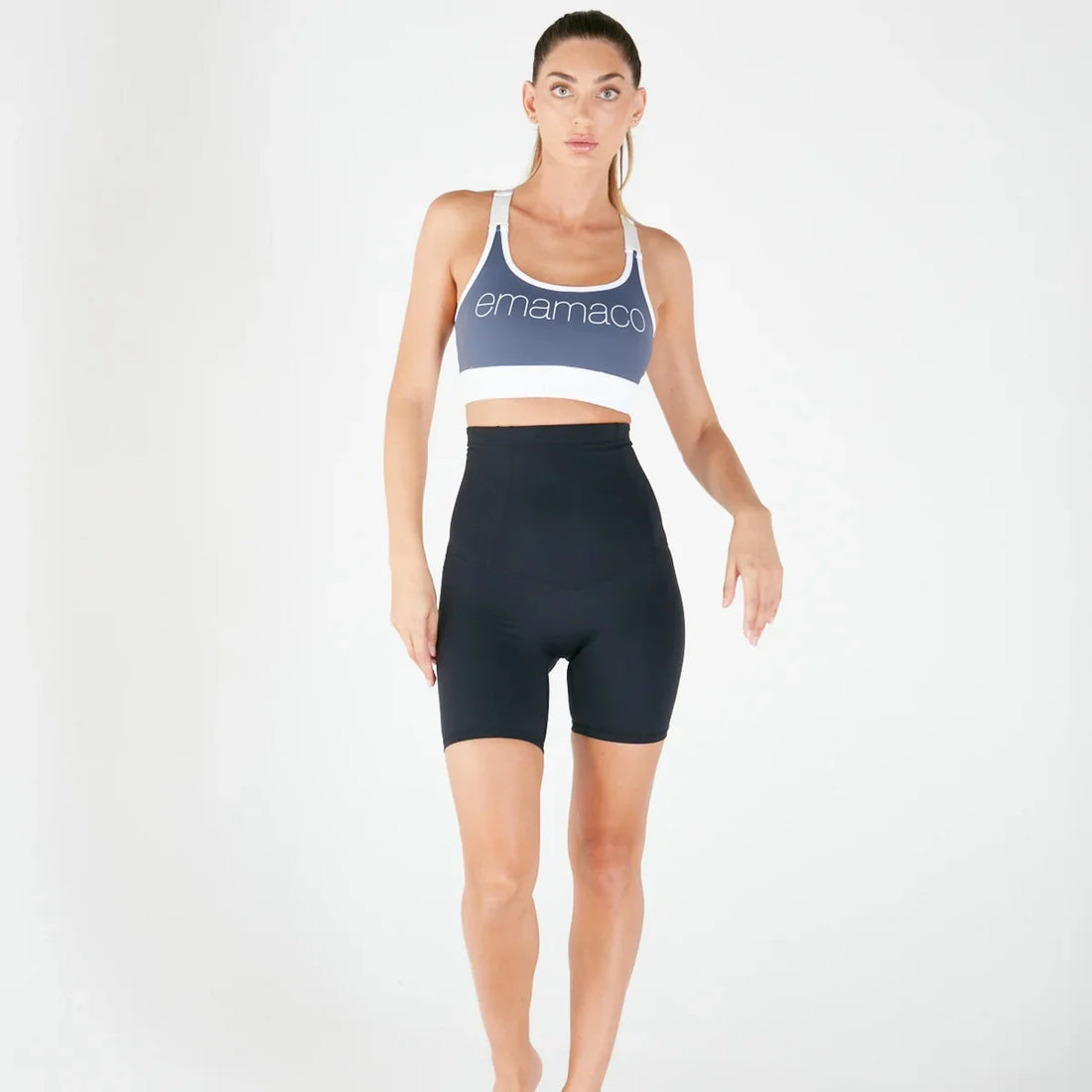 Woman wearing lilac high-waisted postpartum recovery leggings with pockets.